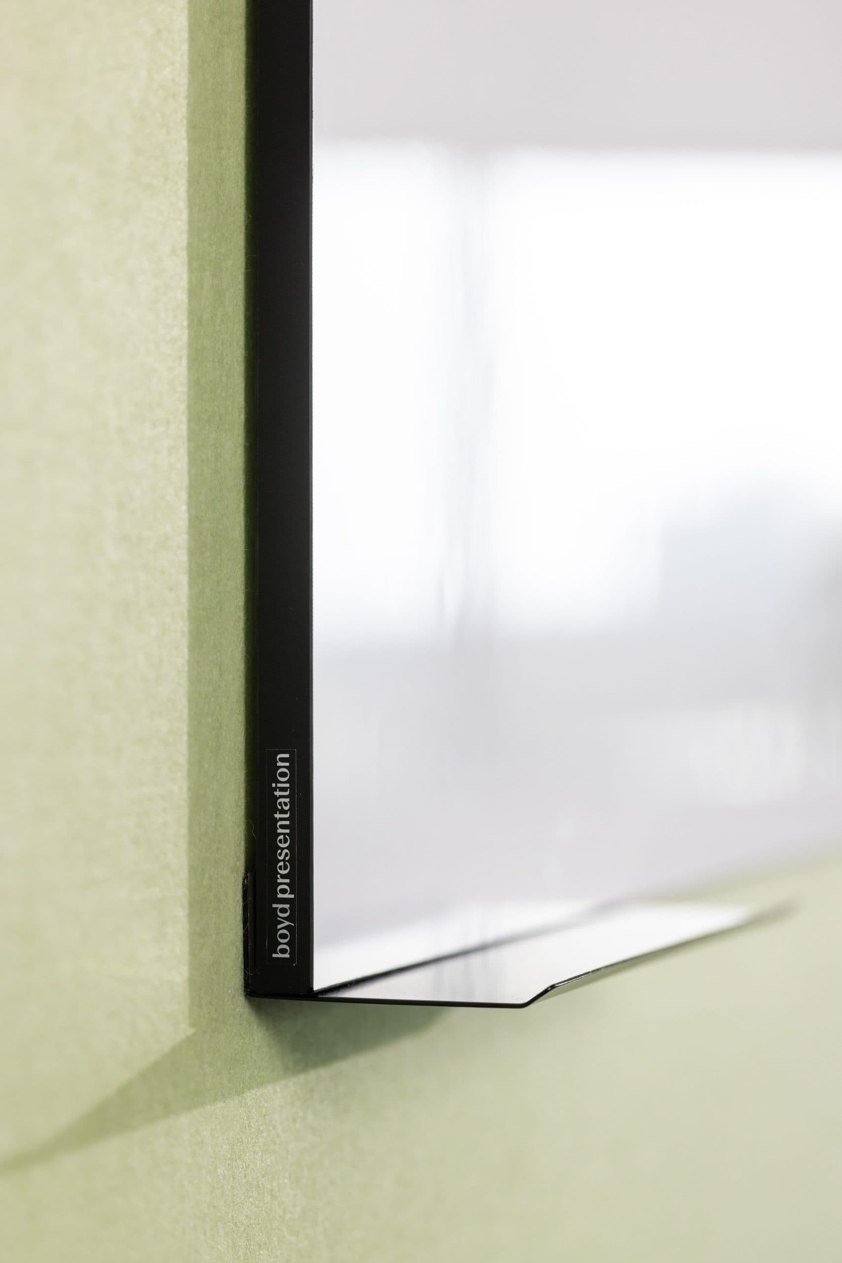 Era whiteboard — frameless black edge with boyd presentation plate, close detail